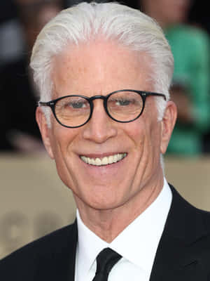 Hollywood Veteran Ted Danson Radiating Charisma In A Close-up Shot Wallpaper