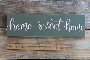 Home Sweet Home On Black Plank Wallpaper