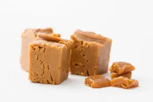 Homemade Penuche Fudge On A Rustic Wooden Table Wallpaper