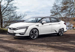 Honda Clarity Electric Sedan Parked On A City Street Wallpaper