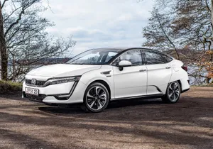 Honda Clarity Electric Sedan Parked On A City Street Wallpaper