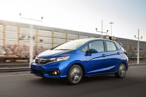 Honda Fit Parked In An Urban Setting Wallpaper