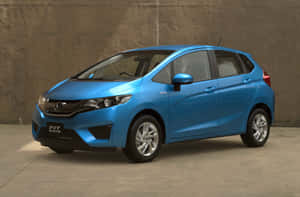 Honda Fit Parked On City Road Wallpaper