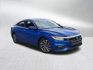 Honda Insight Hybrid Parked By Ocean View Wallpaper