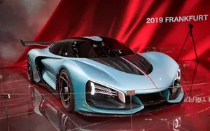 Hongqi Luxury Sedan Cruising On A Picturesque Road Wallpaper