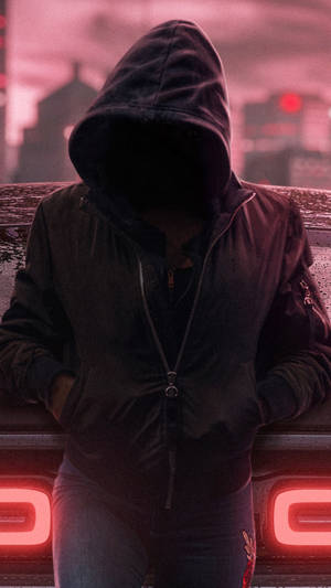 Hooded Stranger On Phone In An Urban Setting Wallpaper