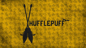 Hufflepuff Broomsticks Against A Dark Background Wallpaper