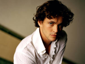 Hugh Dancy In White Outfit Wallpaper