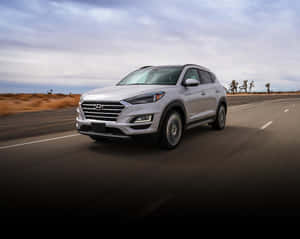 Hyundai Tucson In A Striking Urban Landscape Wallpaper