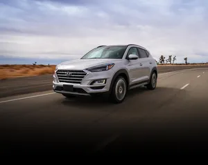 Hyundai Tucson In A Striking Urban Landscape Wallpaper