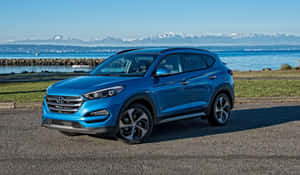 Hyundai Tucson Suv On A Scenic Road Wallpaper