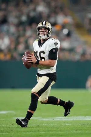 Ian Book Saints Quarterback Action Shot Wallpaper