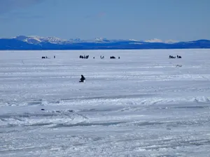 Ice Fishing On A Frozen Lake Wallpaper