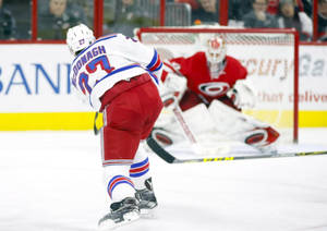 Ice Hockey Star Ryan Mcdonagh In Action Against Carolina Hurricanes Wallpaper