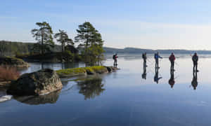 Ice Skatingon Frozen Lake Linkoping Wallpaper