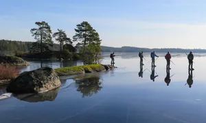 Ice Skatingon Frozen Lake Linkoping Wallpaper
