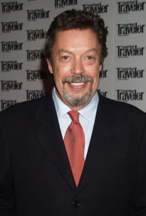 Iconic Actor Tim Curry In Classic Portrait Wallpaper