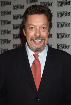 Iconic Actor Tim Curry In Classic Portrait Wallpaper