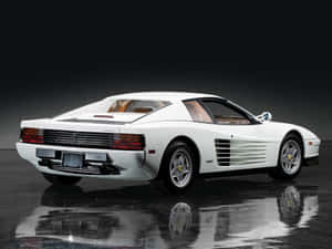 Iconic Ferrari Testarossa On A Scenic Road Wallpaper