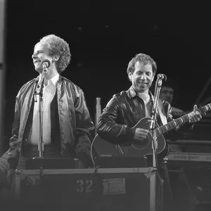 Iconic Folk Duo Performance Wallpaper