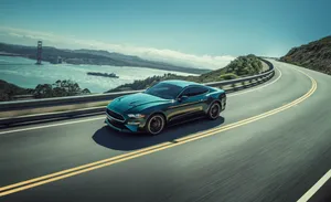Iconic Ford Mustang Bullitt On The Road Wallpaper