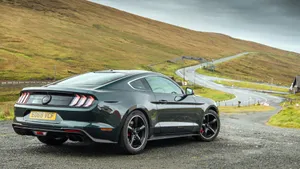 Iconic Ford Mustang Bullitt Roaring Through The Streets Wallpaper