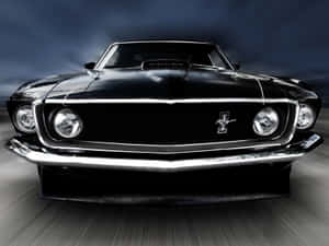 Iconic Ford Mustang Mach 1 In Action Wallpaper