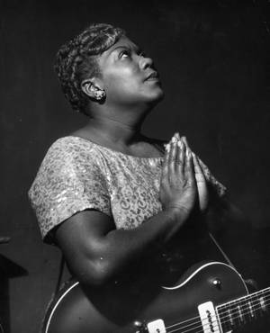 Iconic Gospel Singer, Sister Rosetta Tharpe, In Praying Stance Wallpaper