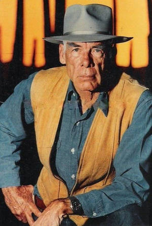Iconic Hollywood Actor Lee Marvin In Brown Vest Wallpaper