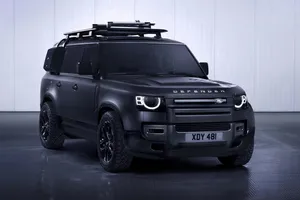 Iconic Land Rover Defender Traversing Rugged Terrain Wallpaper