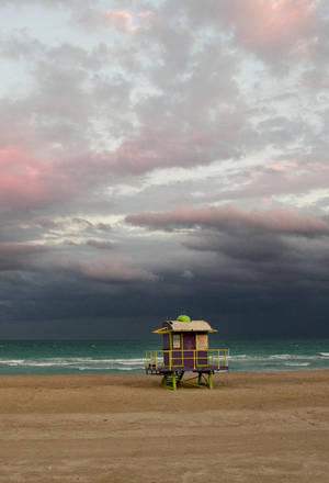 Iconic Lifeguard Tower On Malibu Beach, California Wallpaper