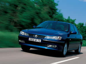 Iconic Peugeot 406 In Majestic Red Color Wallpaper