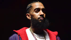 Iconic Rap Artist, Nipsey Hussle On Stage Wallpaper