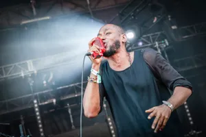 Iconic Rapper Yasiin Bey In Subdued Light Wallpaper