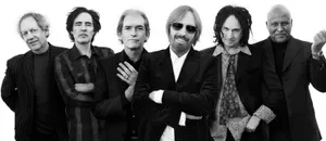 Iconic Tom Petty And The Heartbreakers Electrifying Concert Moment. Wallpaper