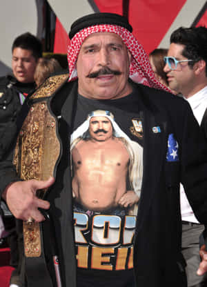 Iconic Wrestling Champion, The Iron Sheik Gazing Intensely+ Wallpaper