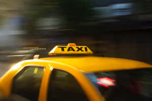 Iconic Yellow Cab In The City Wallpaper