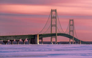 Icy Mackinac Bridge With Gradient Sky Wallpaper