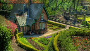 Idyllic Cottage Surroundedby Gardens.jpg Wallpaper