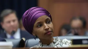 Ilhan Omar Listening To Someone Wallpaper