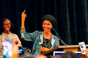 Ilhan Omar Raising One Finger Up Wallpaper