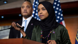Ilhan Omar Speaking About Something Serious Wallpaper
