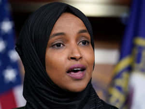 Ilhan Omar Speaking At An Event Wallpaper
