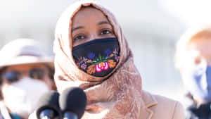 Ilhan Omar Wearing Floral Mask Wallpaper