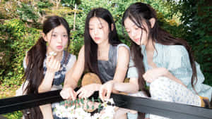 Illit Members Enjoy Outdoor Activity Wallpaper