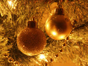 Illuminate Your Christmas With Golden Festive Décor. Wallpaper