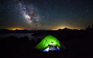 Illuminated Green Camping Tent Wallpaper