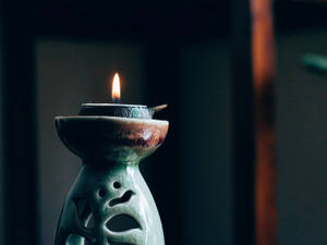 Illuminated Holistic Porcelain Candle Wallpaper