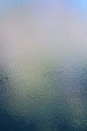 Illuminated Jellyfish Swimming In Deep Blue Ocean Wallpaper