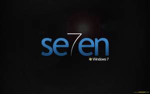 Illuminated Windows 7 Logo On Dark Background Wallpaper